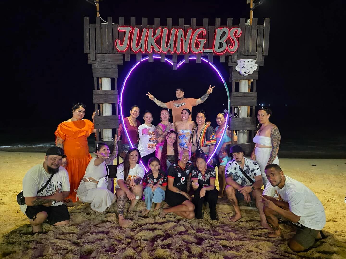 The Awakening Code group retreat on the beach at night